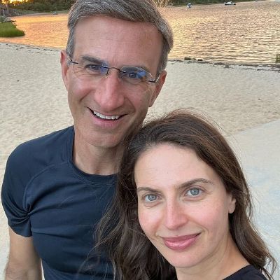 Both are smiling in this selfie.